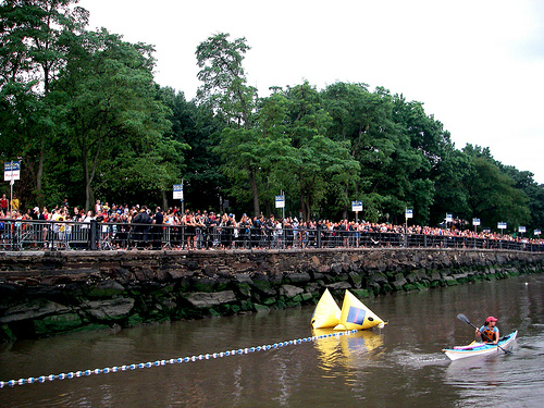 Kyaks and spectators on the river